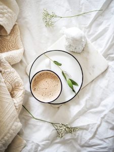 Morning Coffee On a White Bed Sheet
