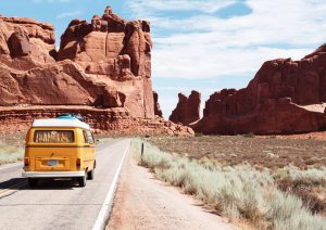 Yellow Bus On A Dusty Road