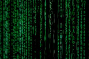 Green code streaming down a black screen